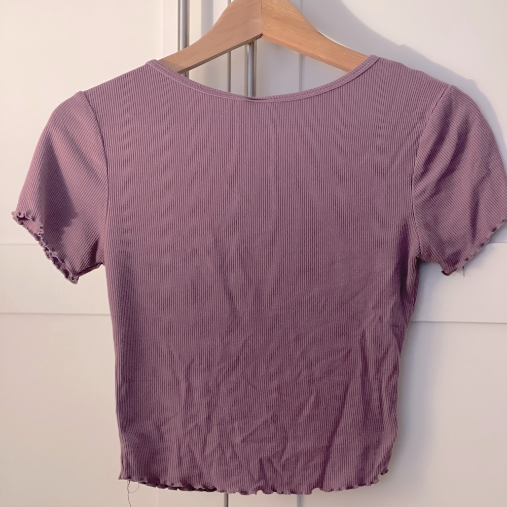 Tight fitting purple shirt